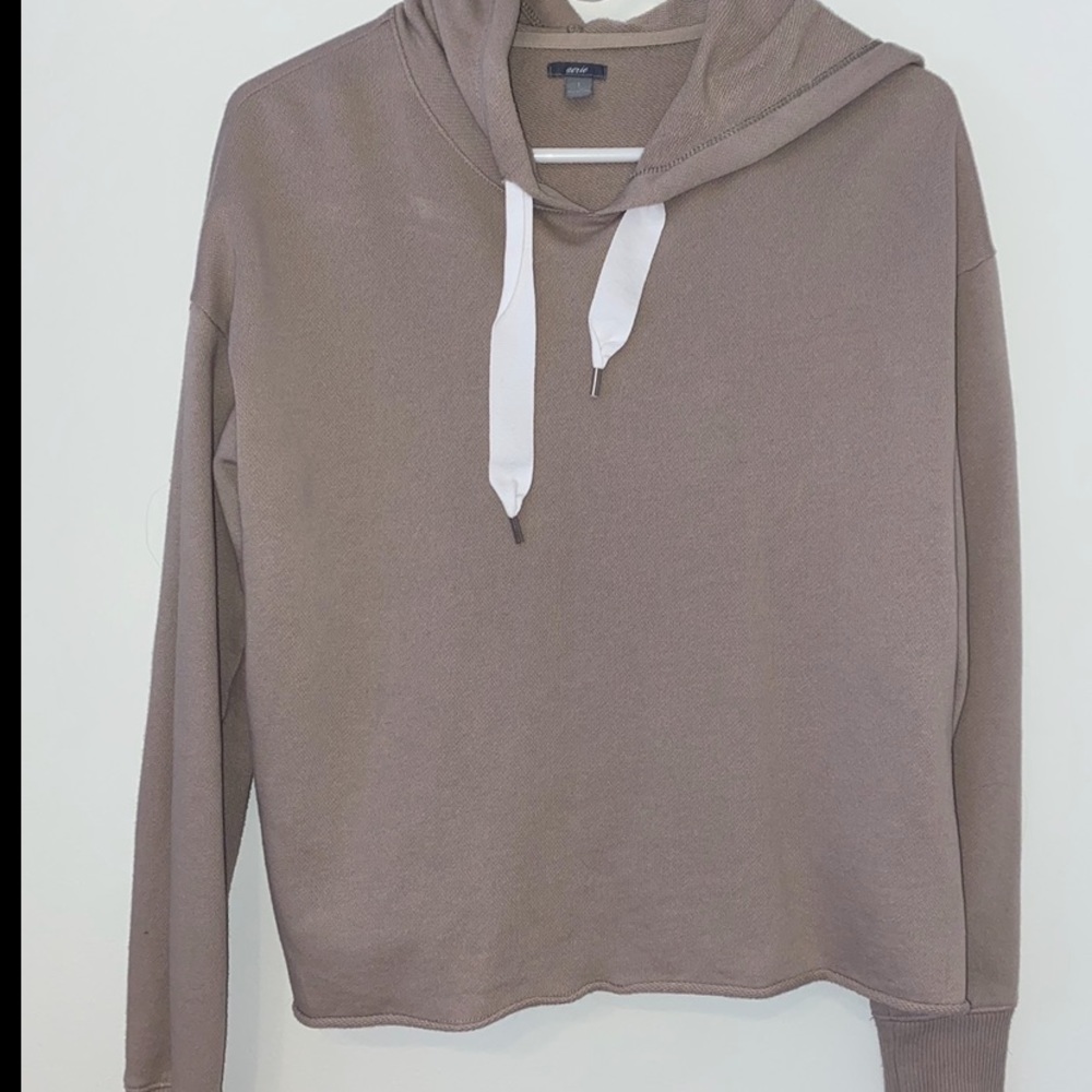 Tan long sleeve top.